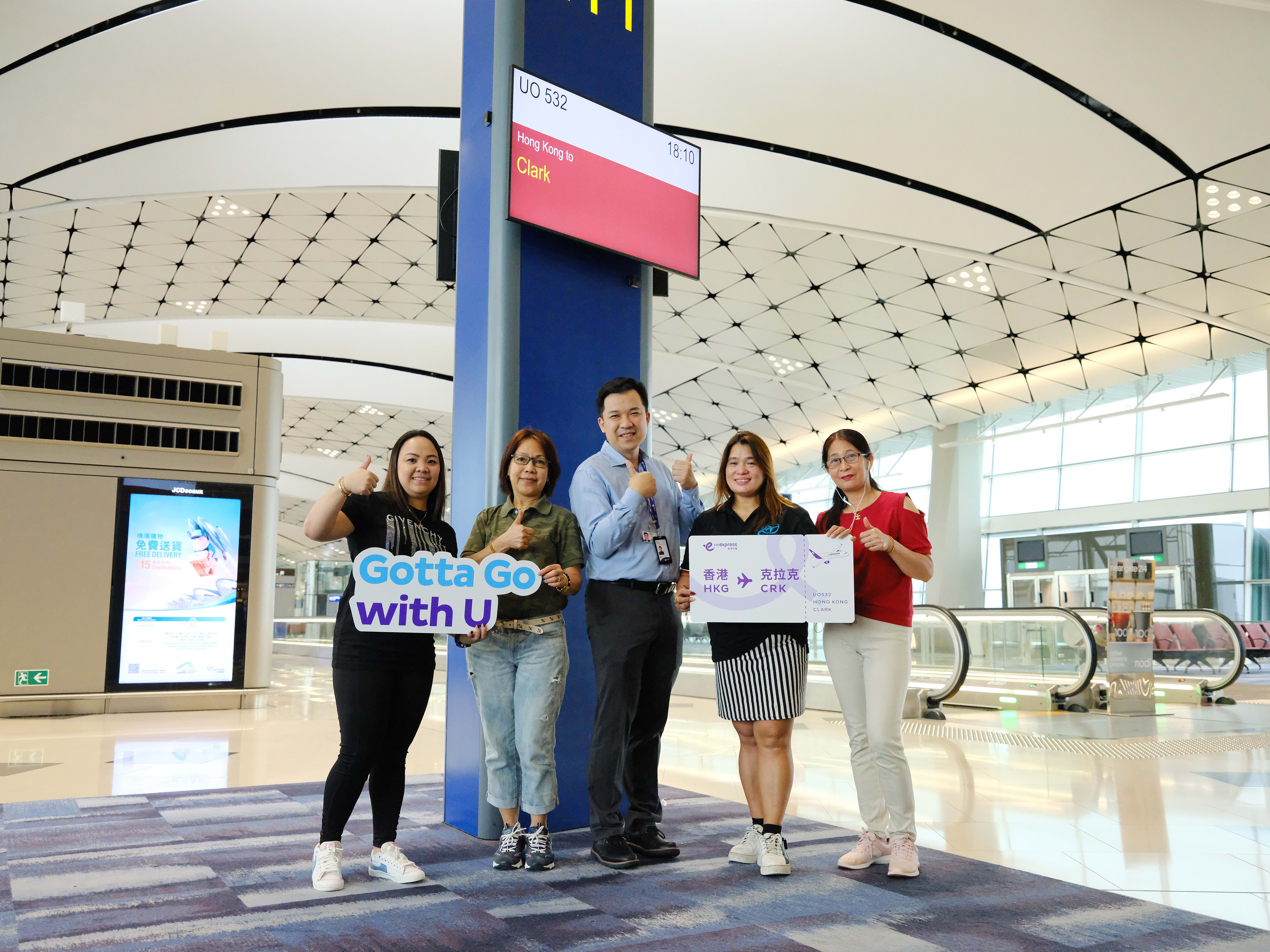 hk-express-management-team-and-passengers-on-the-inaugural-flight-to-clark-took-photos-at-the-boarding-gate-at-hong-kong-international-airport.jpg